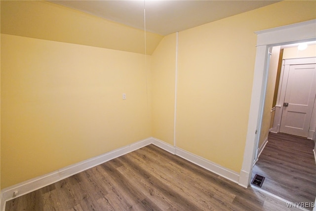 unfurnished room with hardwood / wood-style flooring