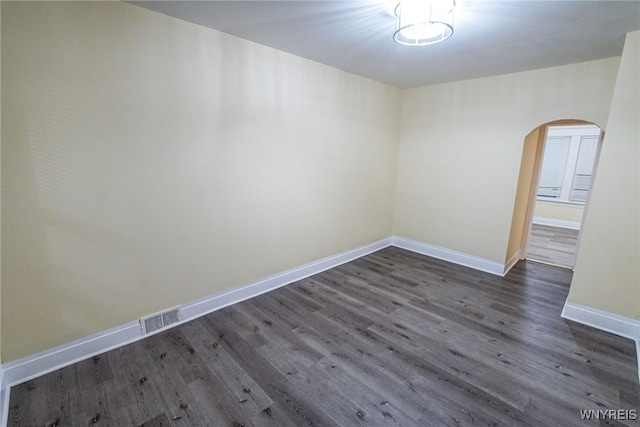 spare room featuring dark hardwood / wood-style floors