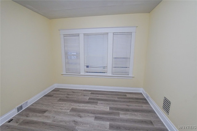 unfurnished room featuring light hardwood / wood-style flooring