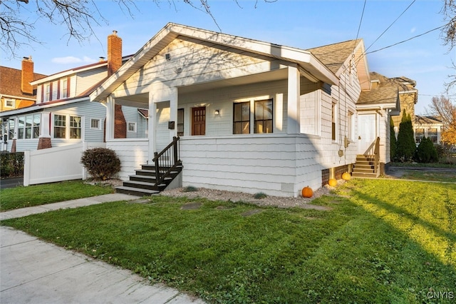 bungalow-style home featuring a front yard