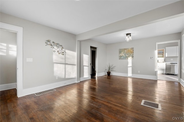 spare room featuring wood-type flooring