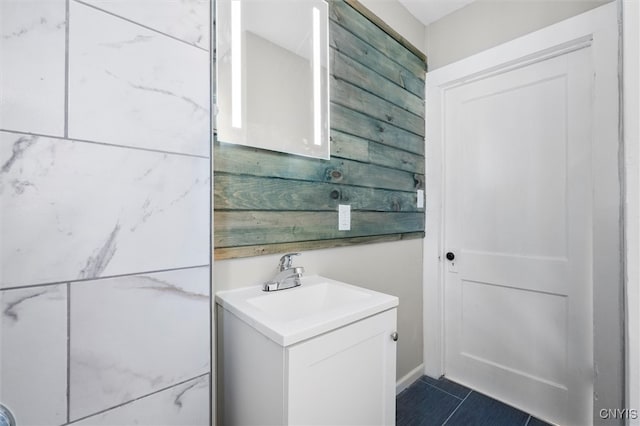 bathroom featuring tile patterned flooring and vanity