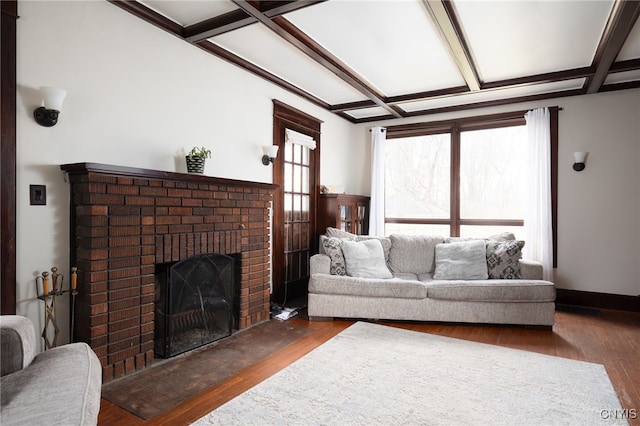 living room featuring dark hardwood / wood-style flooring, a fireplace, and coffered ceiling