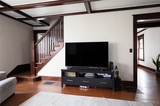 living room with coffered ceiling and hardwood / wood-style flooring