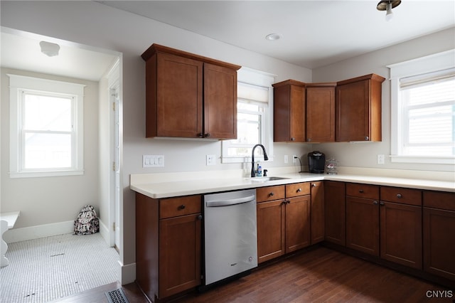 kitchen featuring dishwasher, dark hardwood / wood-style flooring, plenty of natural light, and sink