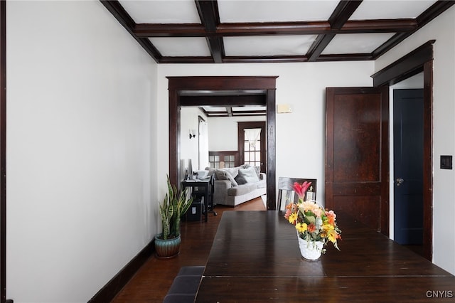 hallway featuring beamed ceiling, dark hardwood / wood-style floors, and coffered ceiling