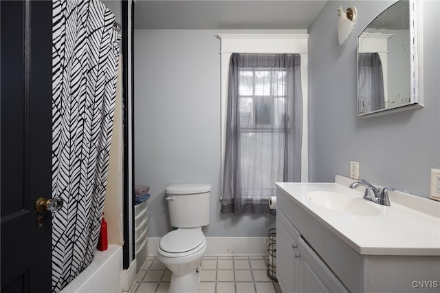 full bathroom featuring tile patterned floors, vanity, toilet, and shower / tub combo