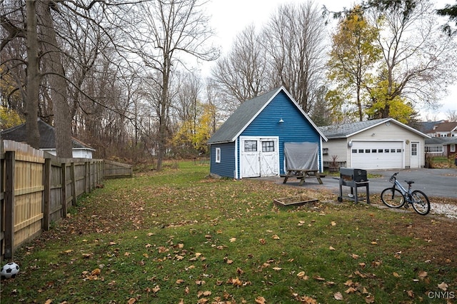 exterior space with an outdoor structure and a garage