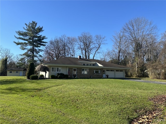 single story home with a front lawn and a garage