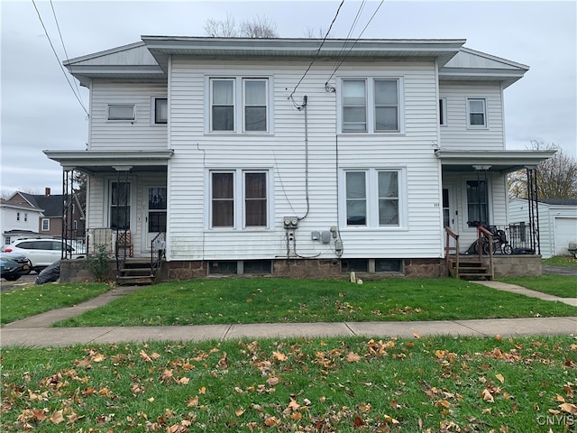 view of front of property with covered porch and a front lawn