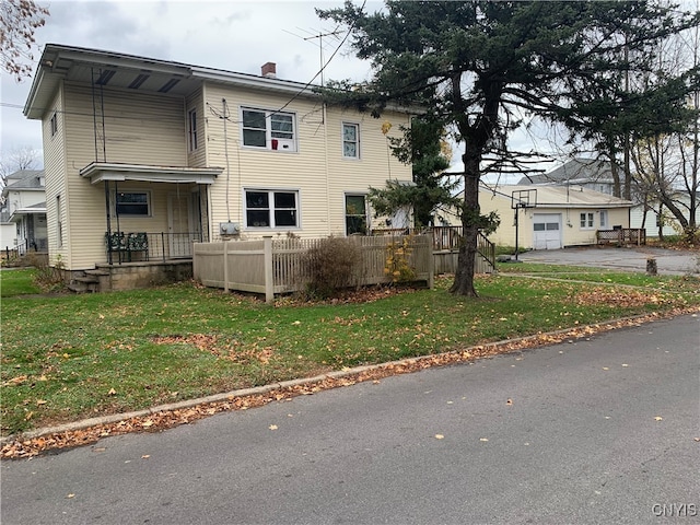 view of property exterior featuring a yard and covered porch