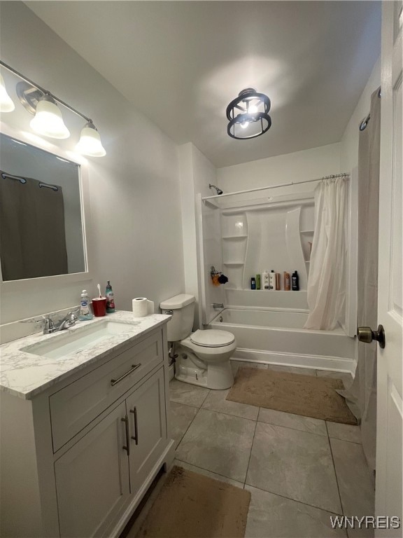 full bathroom with tile patterned flooring, shower / bath combination with curtain, vanity, and toilet