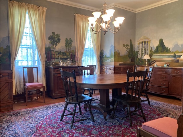 dining area featuring a chandelier, wood-type flooring, plenty of natural light, and crown molding