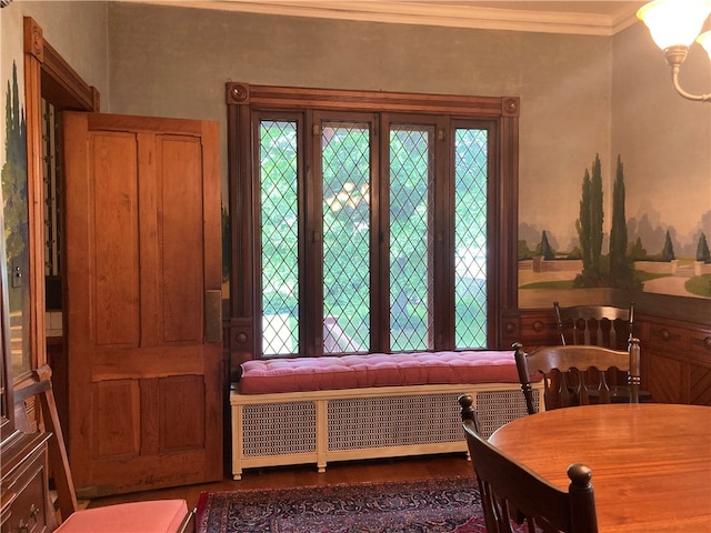 interior space with radiator heating unit and crown molding