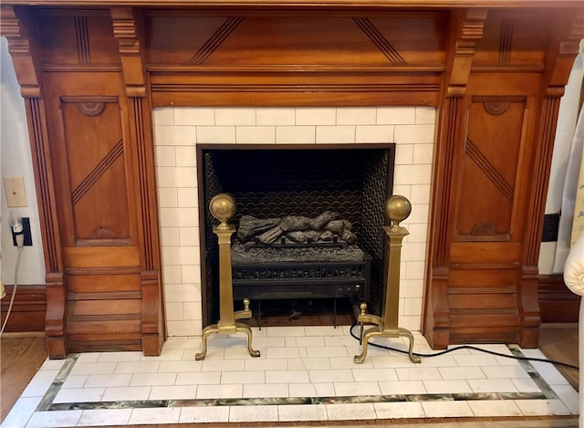 room details featuring a tile fireplace