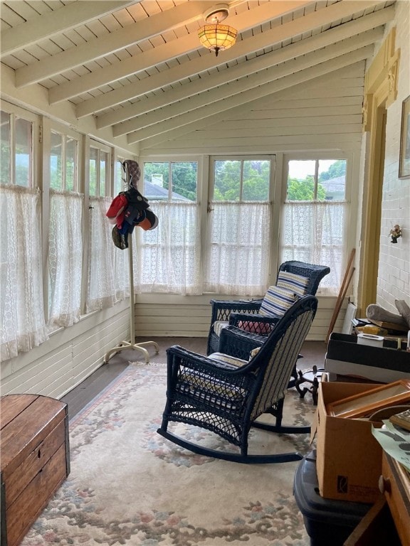 sunroom / solarium with vaulted ceiling with beams and wood ceiling