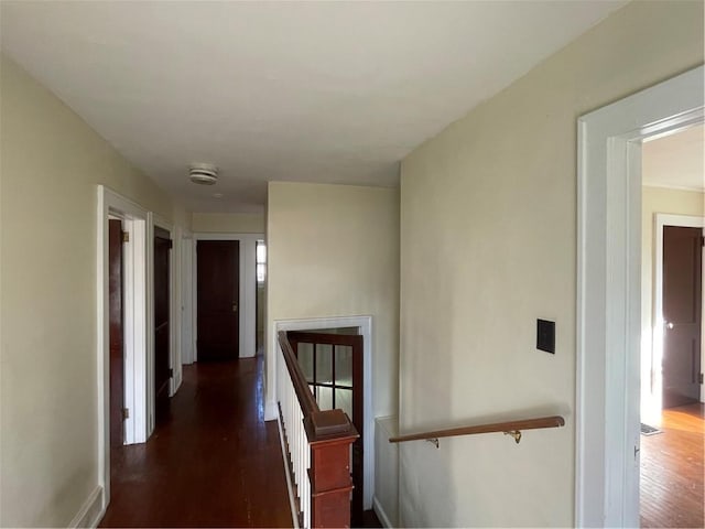 hall with dark hardwood / wood-style flooring