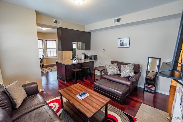 67 Harvard Pl, Buffalo, NY 14209 - living room with dark hardwood / wood-style flooring and sink