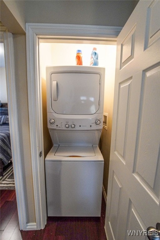 67 Harvard Pl, Buffalo, NY 14209 - washroom with stacked washer / dryer and dark hardwood / wood-style flooring