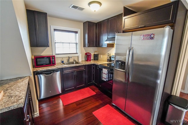 67 Harvard Pl, Buffalo, NY 14209 - kitchen with exhaust hood, black appliances, sink, dark hardwood / wood-style floors, and dark brown cabinets