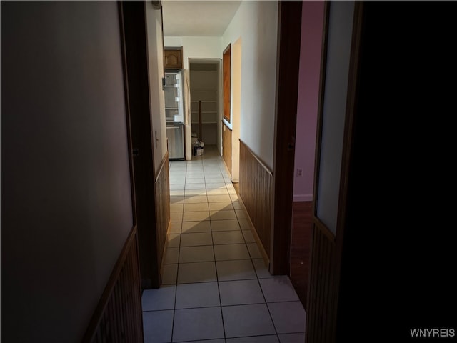 hallway featuring light tile patterned floors