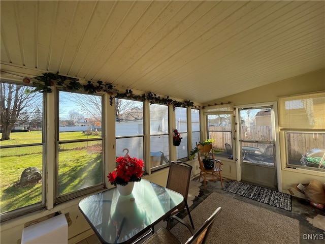 sunroom / solarium with vaulted ceiling