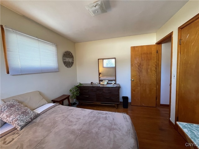 bedroom featuring dark hardwood / wood-style floors