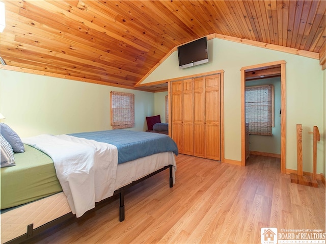 bedroom featuring vaulted ceiling, light hardwood / wood-style flooring, and wood ceiling