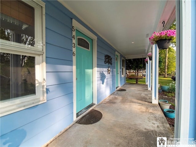 view of patio featuring a porch