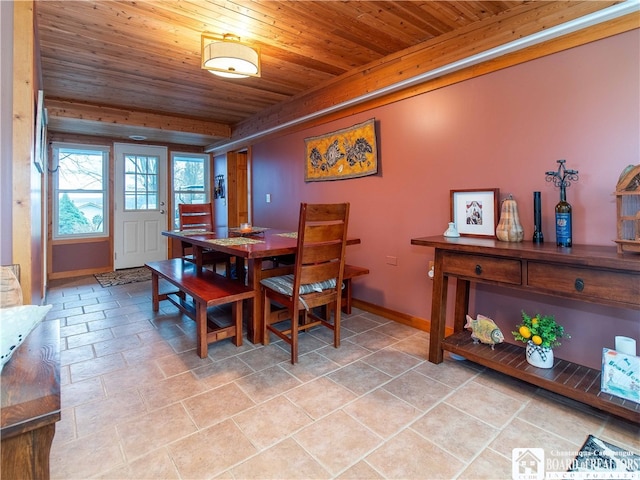 tiled dining space featuring wooden ceiling