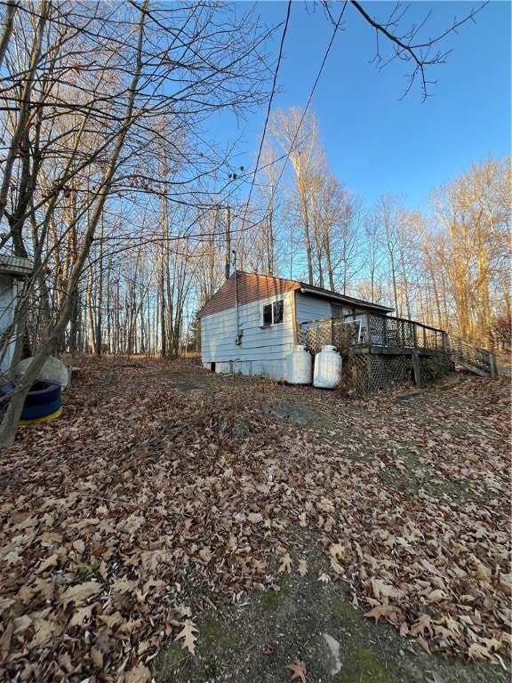 view of property exterior featuring a deck