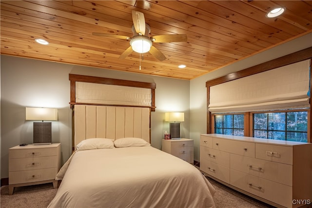 carpeted bedroom with ceiling fan and wooden ceiling