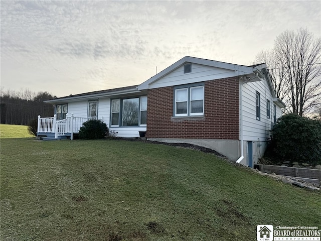 view of front of home with a yard