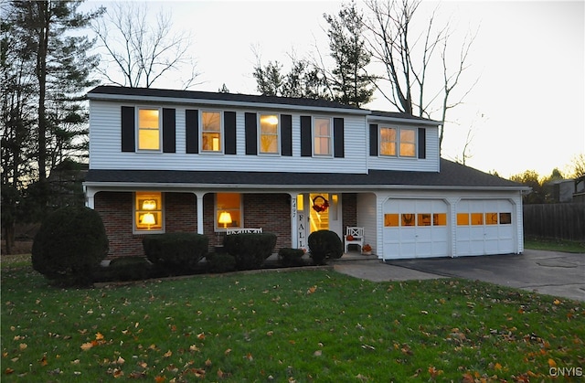 front facade featuring a front lawn and covered porch