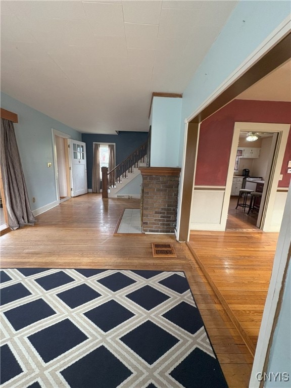 foyer featuring hardwood / wood-style floors and ceiling fan