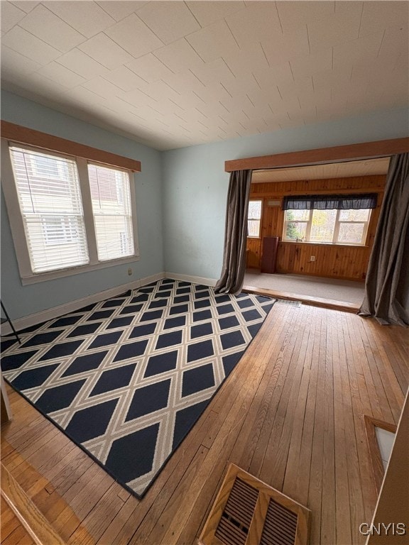 unfurnished room with hardwood / wood-style floors