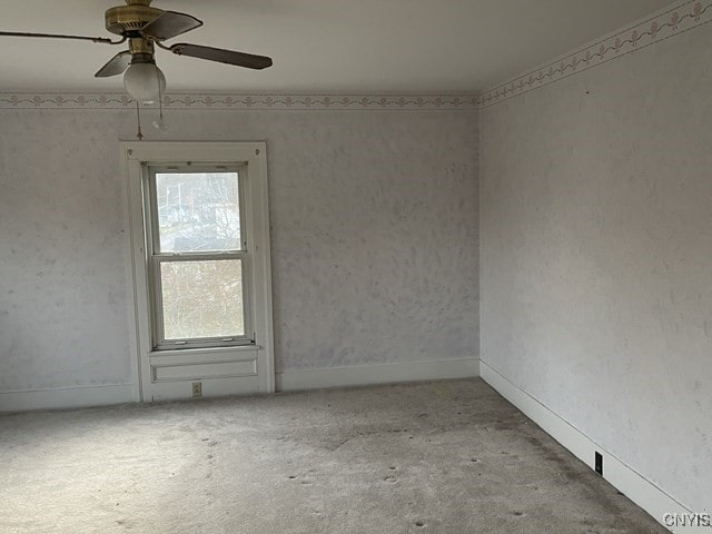 spare room with ceiling fan