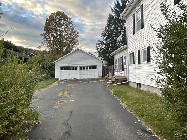 exterior space with an outdoor structure and a garage