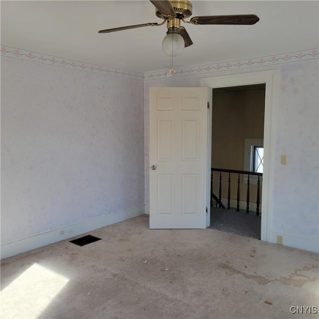 20 Pearl St, Bainbridge, NY 13733 - unfurnished room with carpet flooring, ceiling fan, wallpapered walls, and baseboards