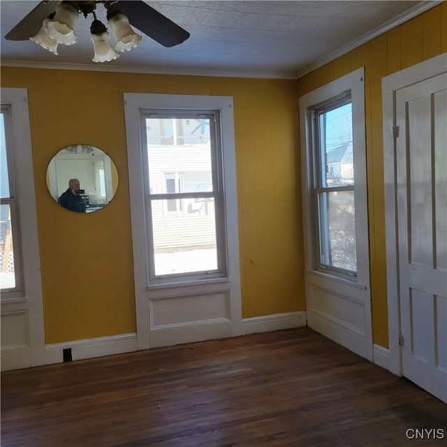 20 Pearl St, Bainbridge, NY 13733 - foyer with wood finished floors, ornamental molding, ceiling fan, and baseboards