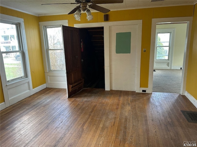 20 Pearl St, Bainbridge, NY 13733 - spare room featuring ornamental molding, hardwood / wood-style flooring, and plenty of natural light