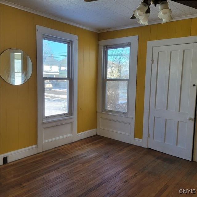 20 Pearl St, Bainbridge, NY 13733 - foyer with ornamental molding, wood finished floors, healthy amount of natural light, and baseboards