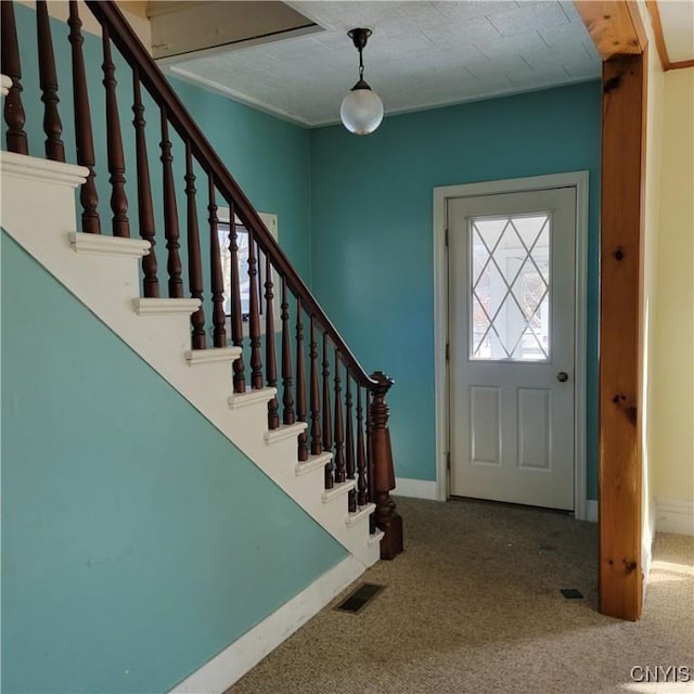 20 Pearl St, Bainbridge, NY 13733 - carpeted entryway with baseboards and stairs