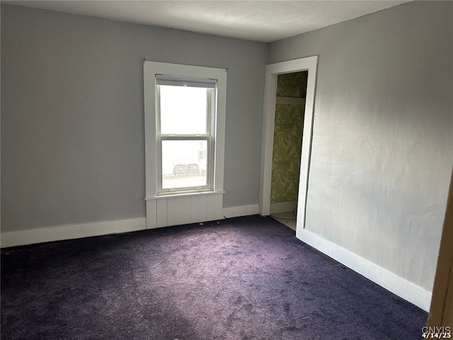 20 Pearl St, Bainbridge, NY 13733 - spare room with dark colored carpet and baseboards