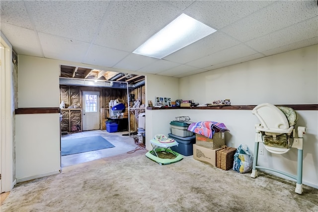 basement featuring a drop ceiling