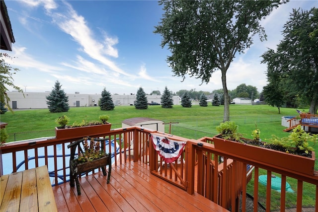 wooden terrace with a yard