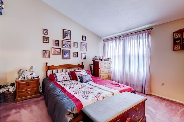 bedroom with carpet flooring and lofted ceiling