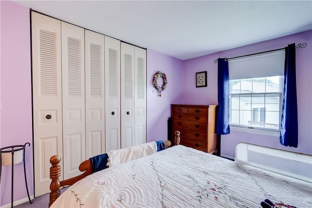 bedroom with carpet flooring and a closet