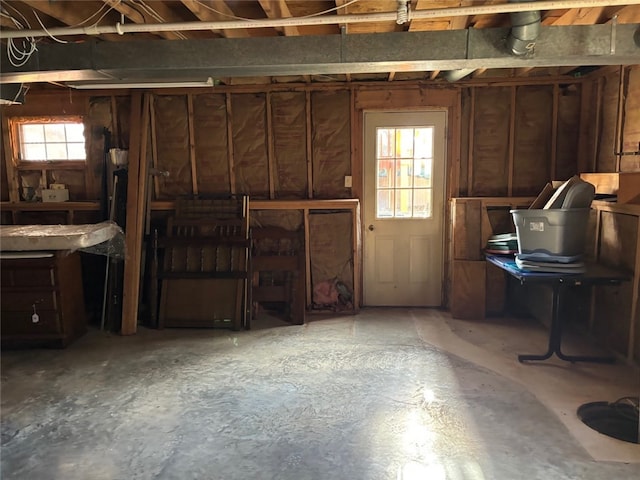 misc room with plenty of natural light and concrete floors