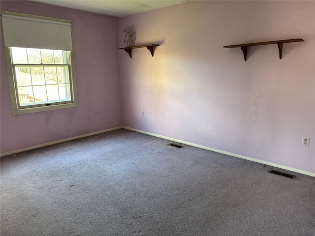 empty room featuring carpet flooring